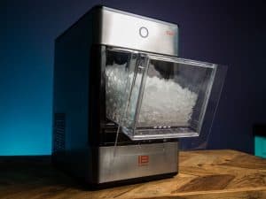 Portable ice maker that makes nugget ice